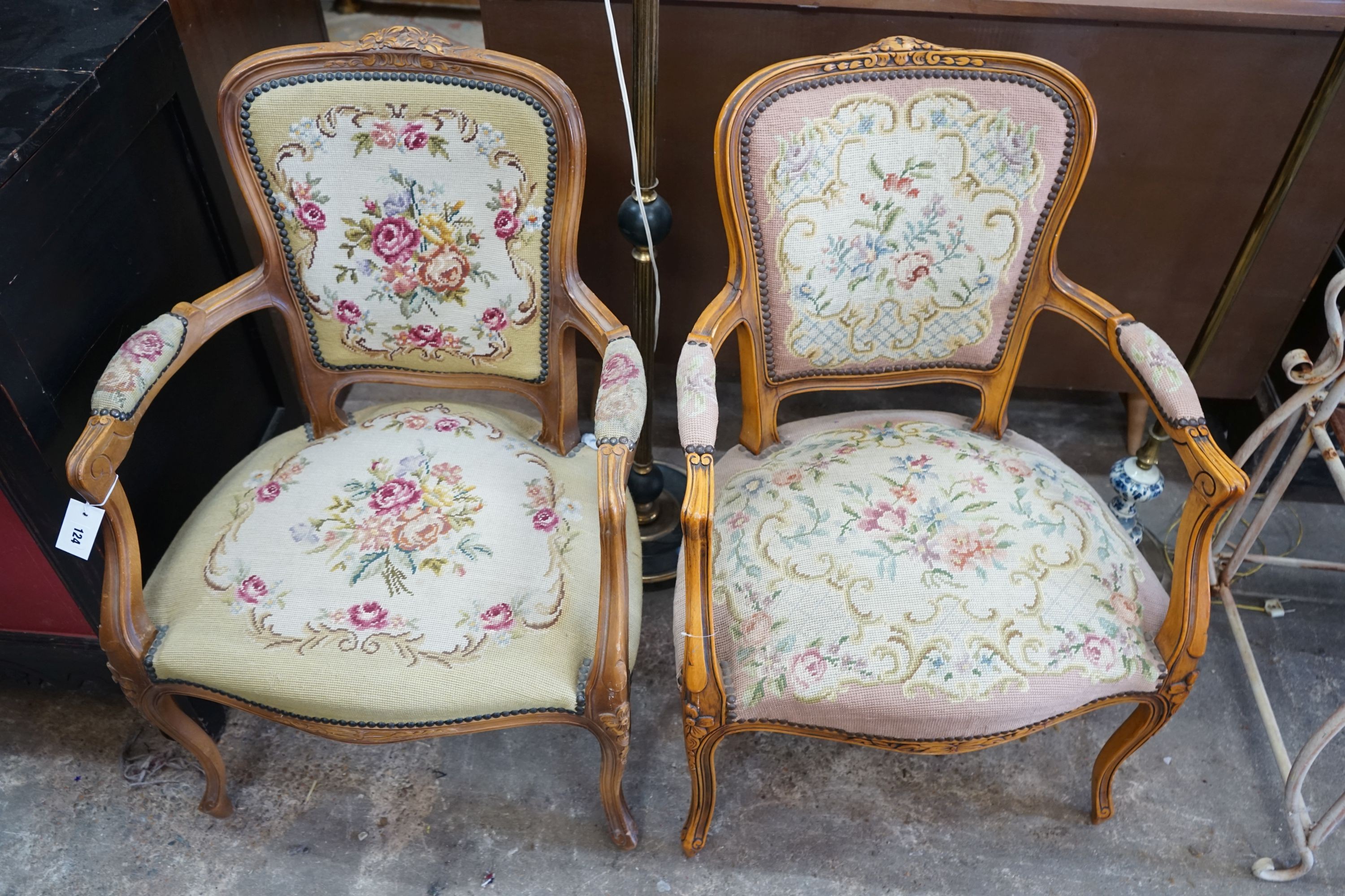 A pair of Louis XVI style carved beech fauteuils